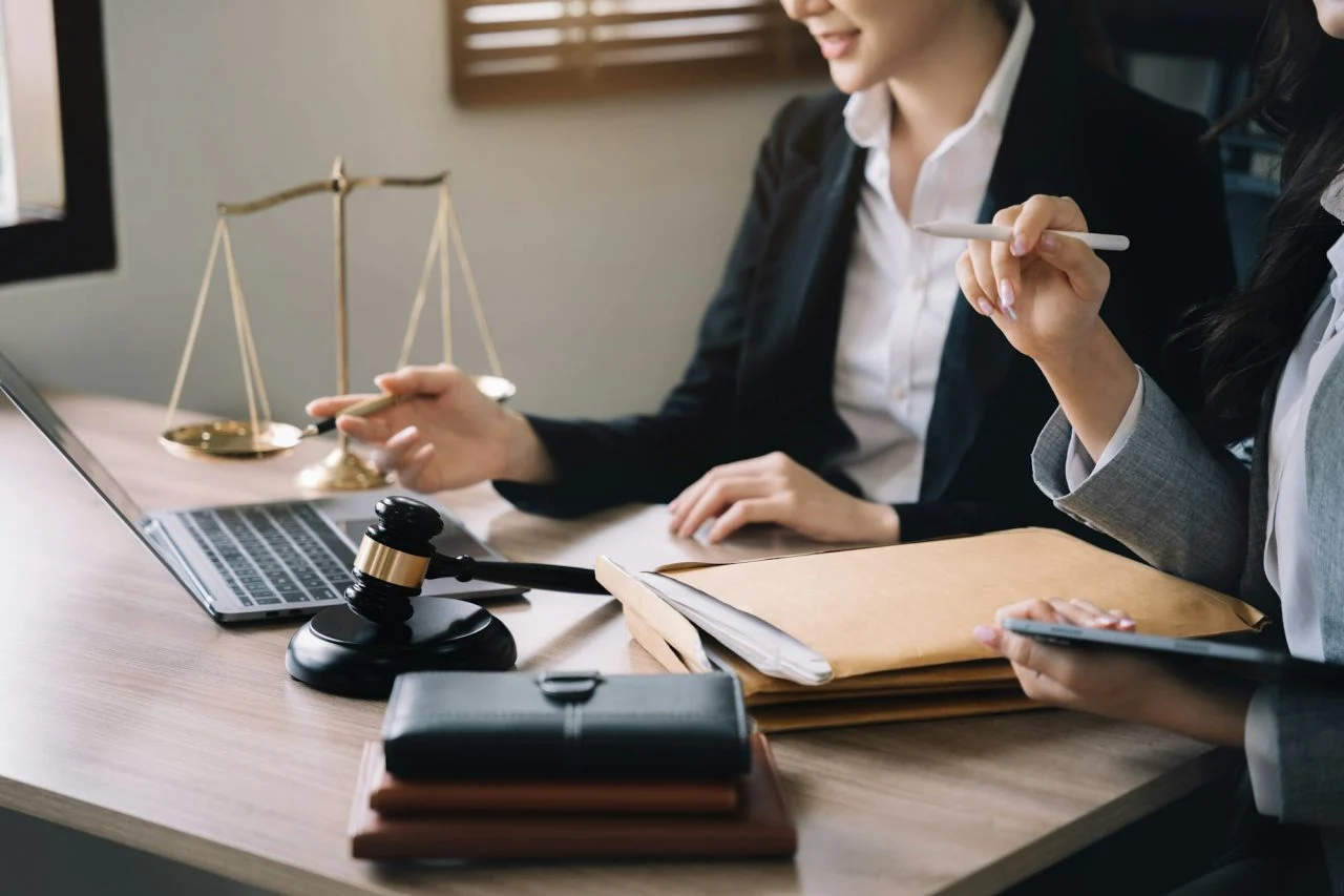 Notary tools, including a gavel and scales of justice, on a desk, representing professional and reliable notary services in Portland, Oregon.