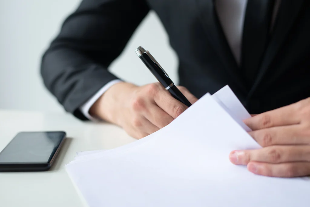 close-up-of-a-professional-providing-a-notary-signature-on-official-documents